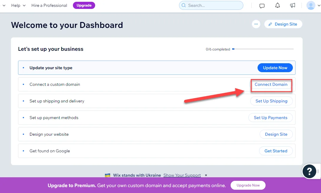 Wix dashboard business setup checklist with a red arrow pointing to the Connect Domain button